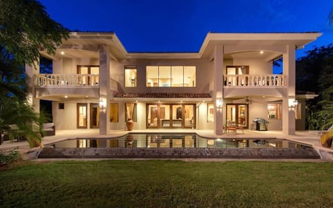 Our  home.
View looking at the back of villa with infinity pool.