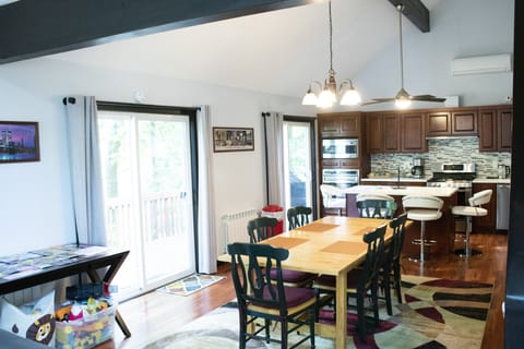 LIVING ROOM LEFT SIDE OF PHOTO INCLUDES CONTAINERS OF TOYS FOR KIDS TO PLAY WITH