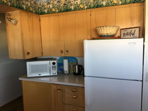 Vintage cabinets preserve the look and functionality of this quaint 50's kitchen