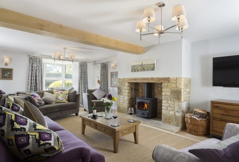 Ground floor:  Spacious sitting room with wood burning stove