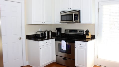 There is a stacked HE washer/dryer in the laundry room off the kitchen.