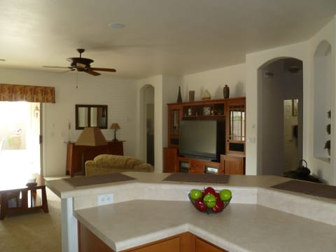 view from kitchen  with bar stools under counter