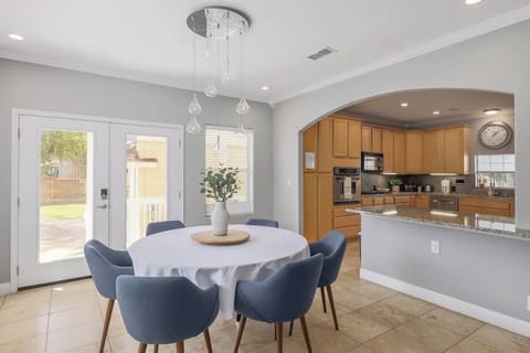 The dining area is off of the kitchen and living area and seats 6