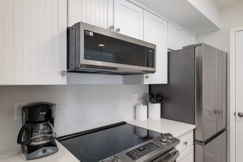 Lovely kitchen has stainless steel appliances
