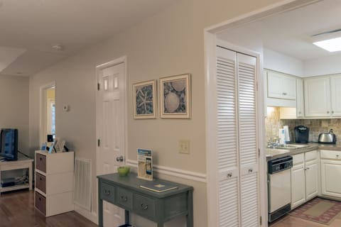 There is a stacked washer and dryer behind the doors.