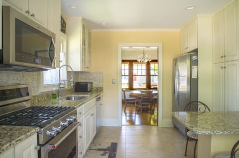Kitchen has slab granite counters and updated throughout.