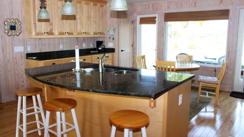 Snack at the counter that has seating for three.