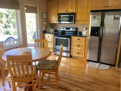 Step to the back deck with golf views to bbq and dine.