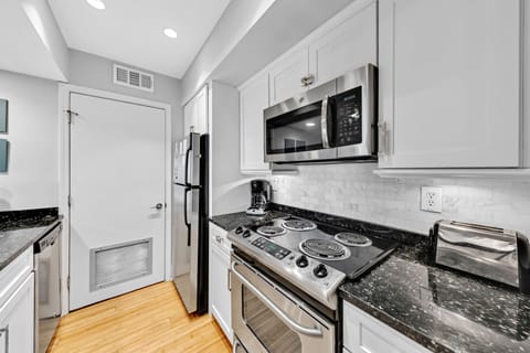 Behind the pantry door in the kitchen you will find the laundry.
