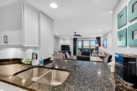 The kitchen pass through lets you converse with those in the great room and take in the ocean view