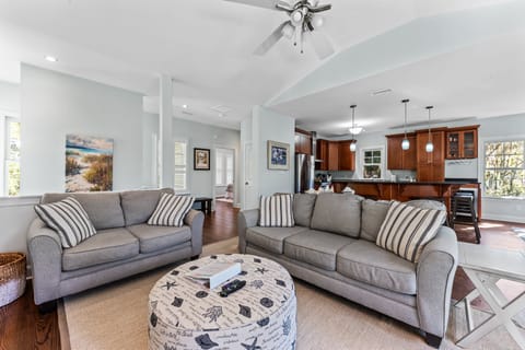 The second floor has an open living area plus sun porch and guest bed & bath.