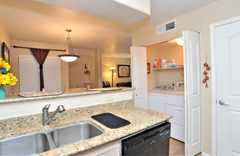 Dishwasher in the kitchen. Newly installed washer and dryer.