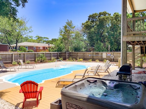 Fenced-in backyard w/ salt water pool, hot tub, grill, lots of seating/lounging