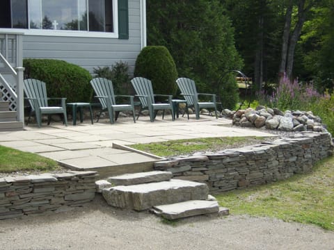 Patio with Adirondack Chairs and Stone Firepit