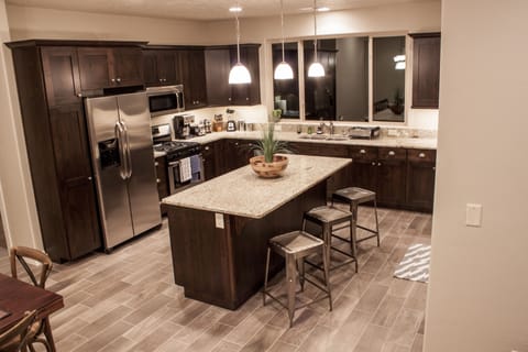 Stay in or go out! Stocked gourmet kitchen; large gathering island