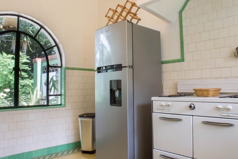 Fully equipped kitchen, new refrigerator. View to gardens & private terrace.