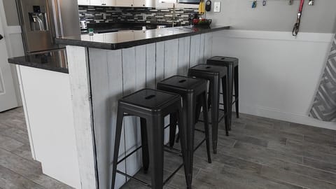 Tile floors throughout.  Bedrooms only carpet.