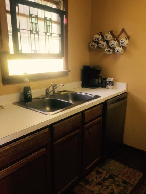 Functional kitchen  with great dishwasher.  That's sunlight, not a poltergeist.