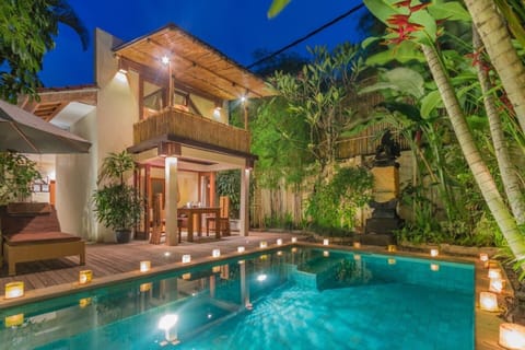 Private pool area with beautiful night lighting