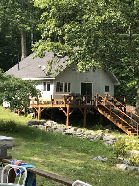 Cabin with full deck facing the lake