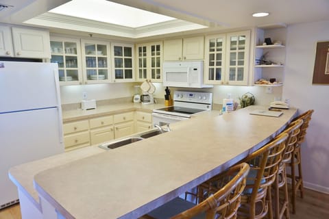Full Kitchen with Bar and Stool Area