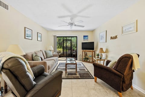 The living room area with access to the porch.