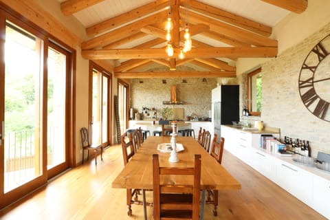 The dining table with a view of the kitchen in the background
