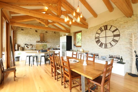 The dining table with a view of the large open kitchen