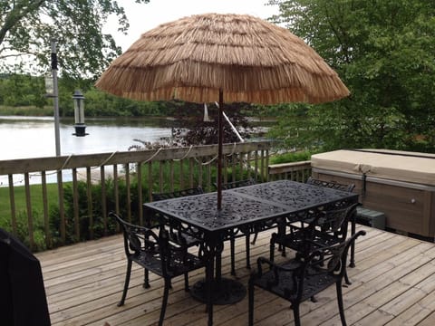 Deck table with umbrella and wonderful view of the water, nature, birds, etc.