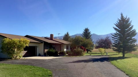 Entering the home from the road on a sunny summer day.