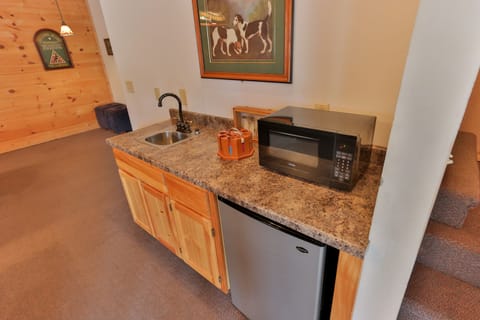 Basement wet bar with mini fridge