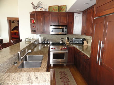 Kitchen in larkspur ski home is open to great room. Wolf range & Subzero fridge.