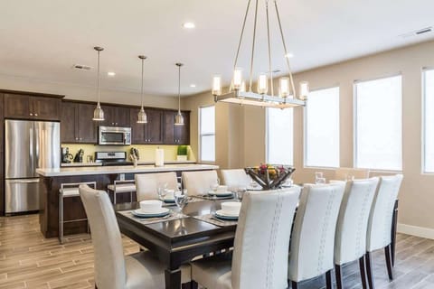 Gorgeous open concept kitchen with dining table for 12