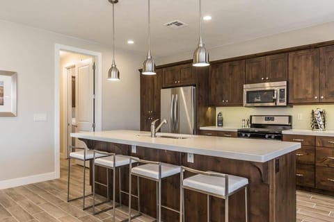 Gorgeous custom kitchen with large bar seats 4