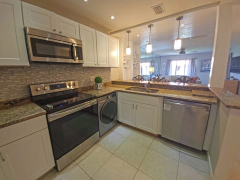 Kitchen now has washer/dryer combo.