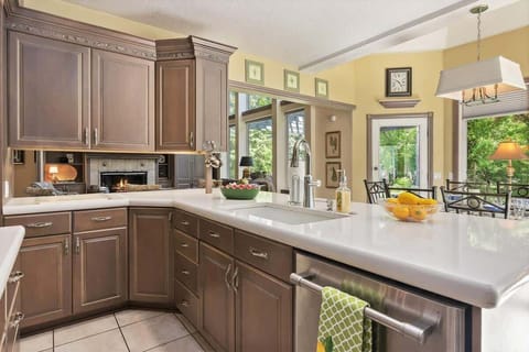 Designer kitchen with beautiful garden view open to great room