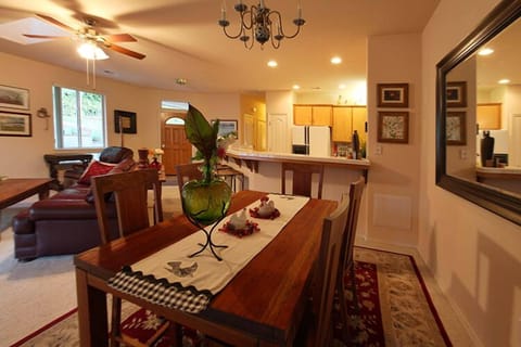 Mohogany table in dining space, off of sliding glass door to patio and spa.  