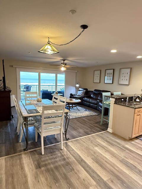Inside of condo looking out to beach and ocean.