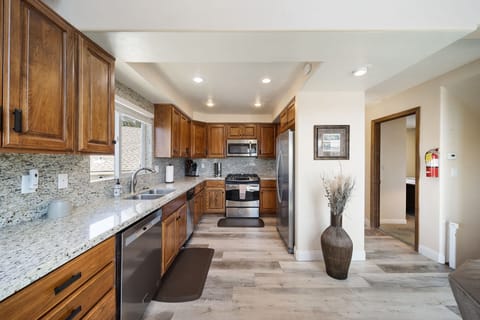 Kitchen on the main floor level w/Living Room, Guest Bedroom & Bath & Large Deck