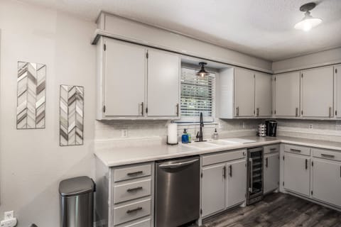 Kitchen stocked with cooking & entertaining essentials; including wine fridge