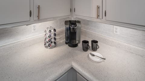 Kitchen with Keurig machine and k-cups provided for tasty morning coffee