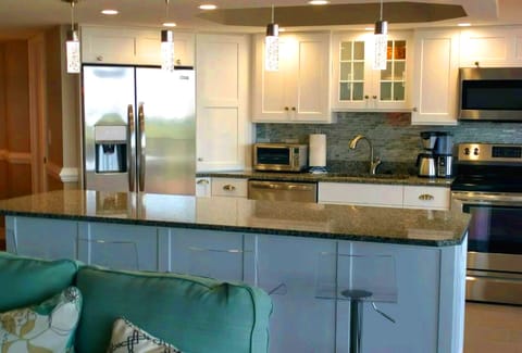 Large, bright kitchen with counter seating
