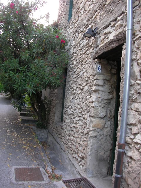 Main entrance on back street. Very peaceful and cool.