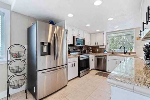 Cook a meal int the bright kitchen with updated appliances.