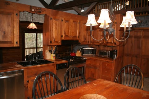 kitchen: stainless appliance, dishwasher, highchair ,coffee pot, kuerig,toaster