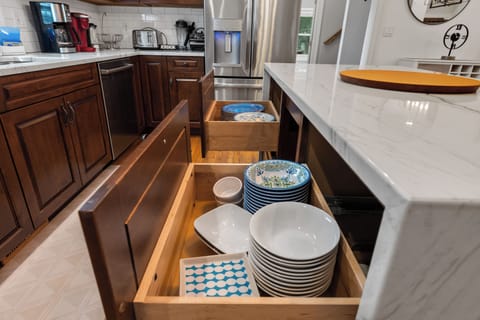Kitchen.  Convenient pull out drawers for Plates and Bowls.