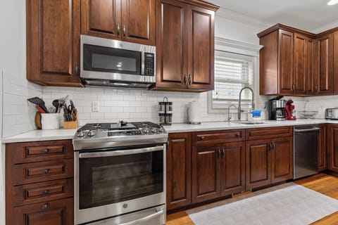 Kitchen.  Quartzite counter tops.  Stainless Steel appliances.  