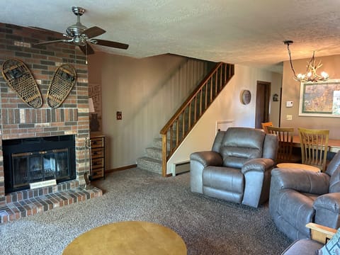 Stairway leads to the master bedroom and the twin bedroom and two full bathrooms