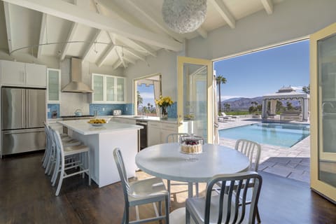 Kitchen features Viking appliances and direct pool access with incredible views.