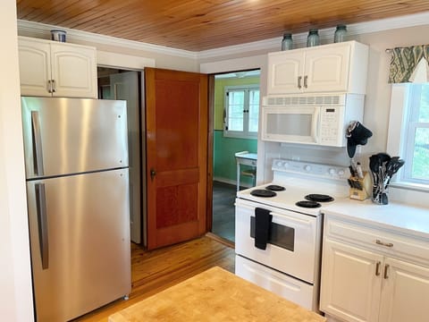 Kitchen with doors leading to bedroom #3 and retro room